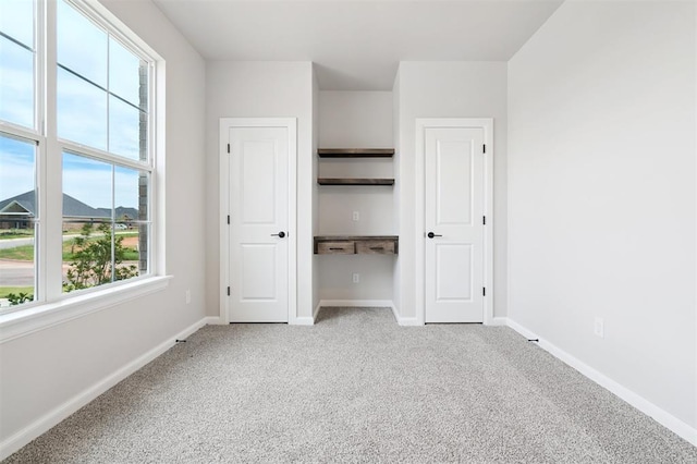10400 SW 51st St, Mustang, OK 73064 - unfurnished bedroom with light colored carpet and baseboards