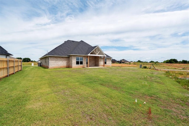 10400 SW 51st St, Mustang, OK 73064 - back of property featuring brick siding and a patio area