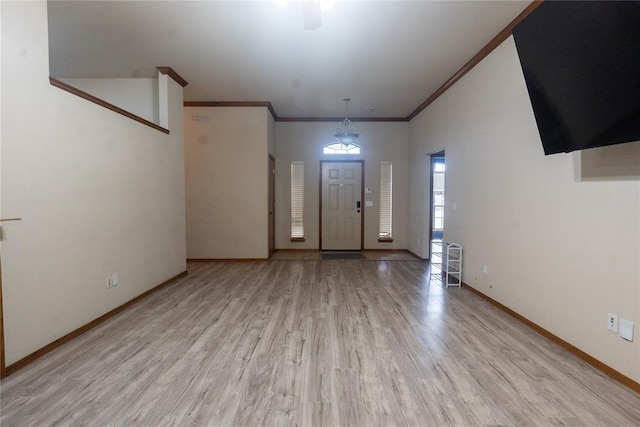 2728 SE 93rd St, Moore, OK 73160 - entrance foyer featuring light wood-style floors and ornamental molding