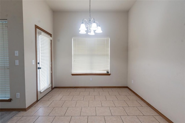2728 SE 93rd St, Moore, OK 73160 - unfurnished room with a chandelier and baseboards
