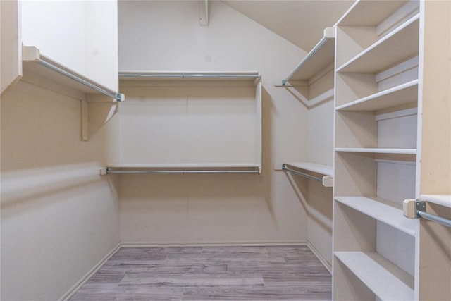 2728 SE 93rd St, Moore, OK 73160 - spacious closet featuring wood finished floors
