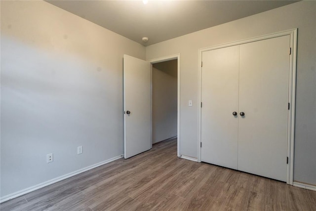 2728 SE 93rd St, Moore, OK 73160 - unfurnished bedroom featuring wood finished floors and a closet
