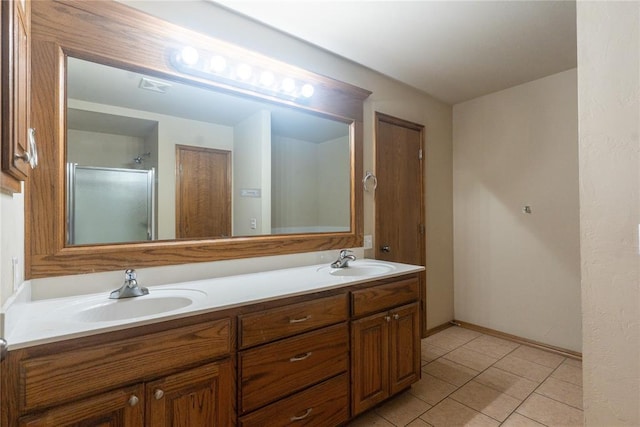 2728 SE 93rd St, Moore, OK 73160 - bathroom with double vanity, tile patterned floors, and a shower with shower door