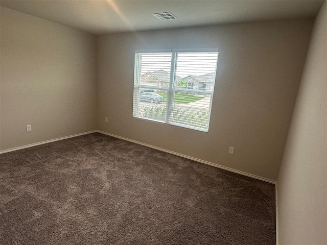 9505 Saddle Dr, Yukon, OK 73099 - spare room featuring dark carpet