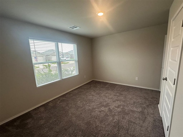9505 Saddle Dr, Yukon, OK 73099 - unfurnished room featuring dark carpet and baseboards