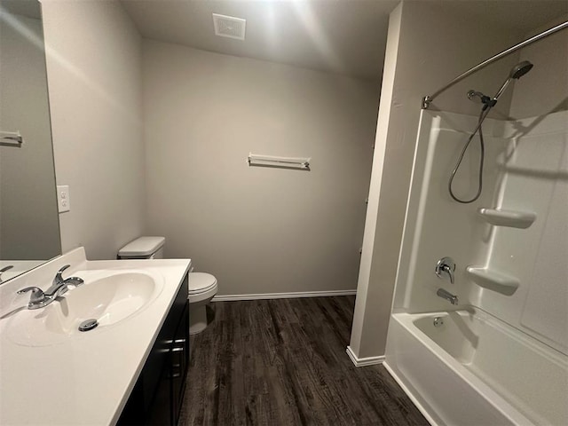 9505 Saddle Dr, Yukon, OK 73099 - bathroom featuring vanity, wood finished floors, and shower / bath combination