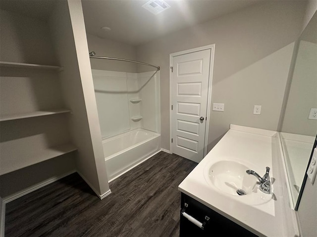 9505 Saddle Dr, Yukon, OK 73099 - full bathroom with vanity, wood finished floors, and bathtub / shower combination