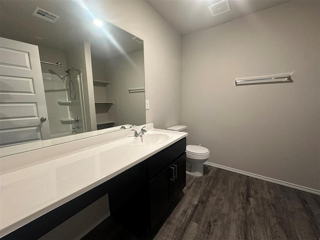 9505 Saddle Dr, Yukon, OK 73099 - full bathroom with wood finished floors, vanity, and  shower combination