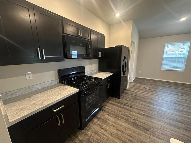9505 Saddle Dr, Yukon, OK 73099 - kitchen featuring black appliances, dark wood-style floors, dark cabinetry, light countertops, and recessed lighting