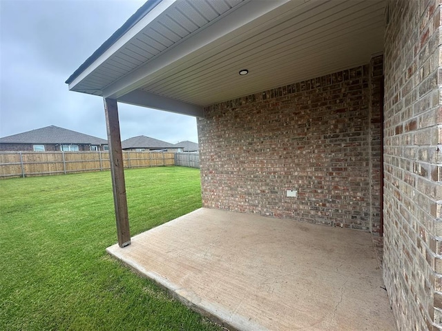 9505 Saddle Dr, Yukon, OK 73099 - fenced backyard with a patio area