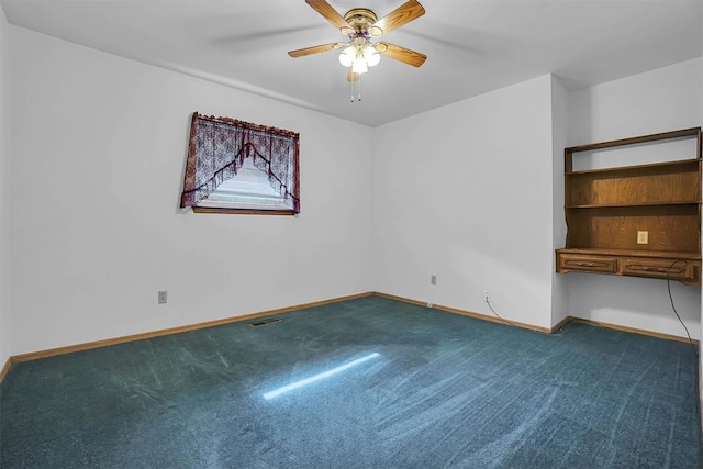813 Tottingham Rd, Anadarko, OK 73005 - unfurnished room featuring ceiling fan and dark colored carpet