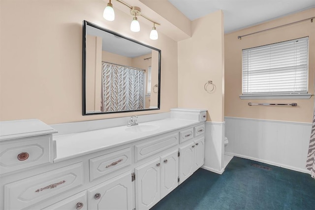 813 Tottingham Rd, Anadarko, OK 73005 - full bath featuring vanity and wainscoting