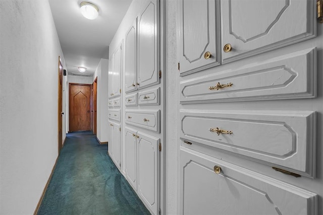 813 Tottingham Rd, Anadarko, OK 73005 - corridor featuring dark carpet