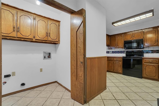813 Tottingham Rd, Anadarko, OK 73005 - kitchen with black appliances, brown cabinets, light tile patterned floors, backsplash, and tile counters