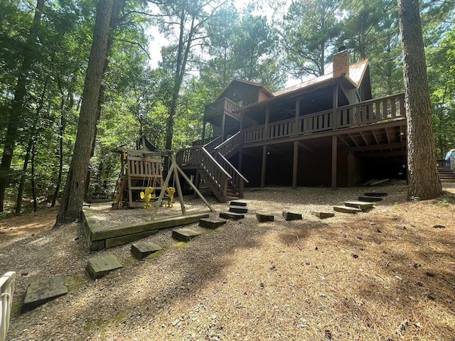 113 Bentwater Rd, Broken Bow, OK 74728 - back of property with stairway, a wooden deck, and a chimney