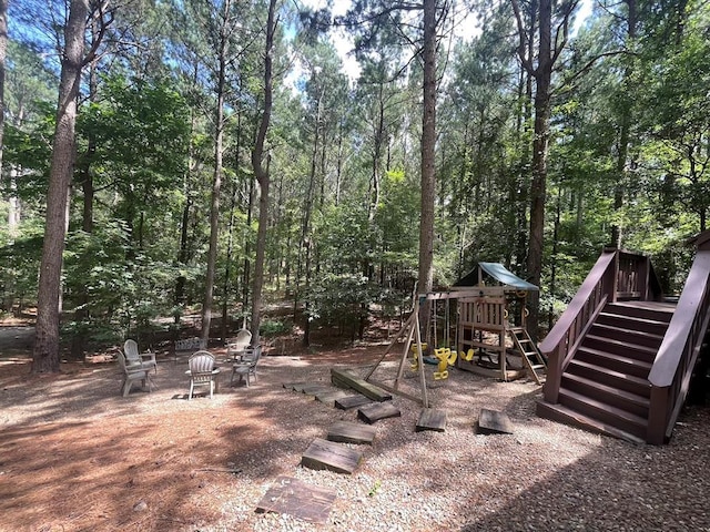 113 Bentwater Rd, Broken Bow, OK 74728 - view of yard featuring a playground and stairs