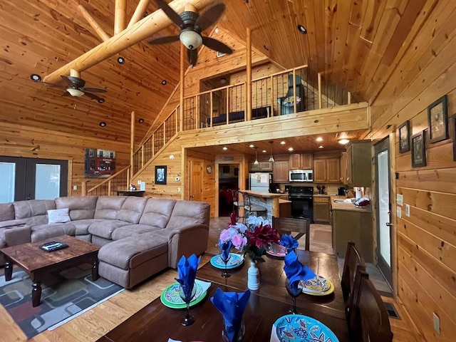 113 Bentwater Rd, Broken Bow, OK 74728 - living area with ceiling fan, wooden walls, wooden ceiling, high vaulted ceiling, and light wood-type flooring