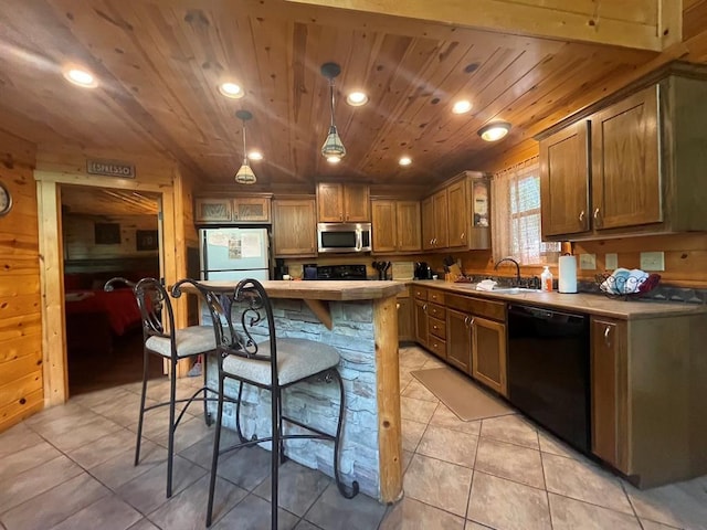 113 Bentwater Rd, Broken Bow, OK 74728 - kitchen with dishwasher, stainless steel microwave, freestanding refrigerator, wood ceiling, and a breakfast bar area