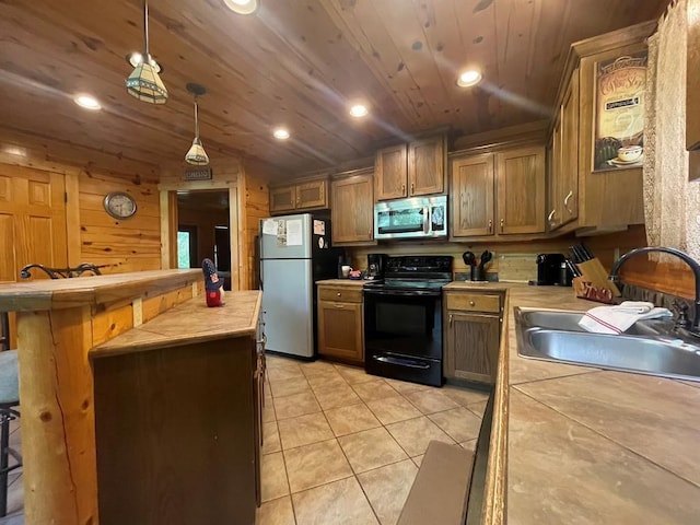 113 Bentwater Rd, Broken Bow, OK 74728 - kitchen featuring stainless steel microwave, black electric range, freestanding refrigerator, wood ceiling, and light tile patterned floors