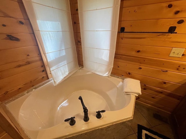 113 Bentwater Rd, Broken Bow, OK 74728 - bathroom with a garden tub and wood walls