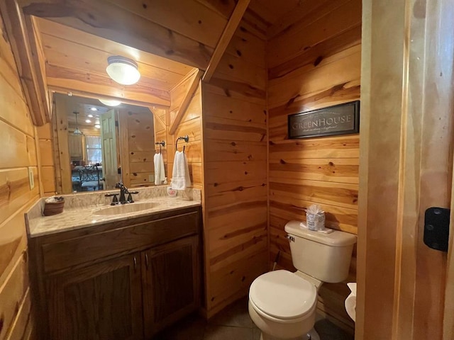 113 Bentwater Rd, Broken Bow, OK 74728 - bathroom with wooden walls, vanity, and tile patterned floors