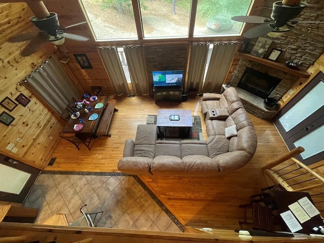 113 Bentwater Rd, Broken Bow, OK 74728 - living area with ceiling fan, a stone fireplace, and wood finished floors