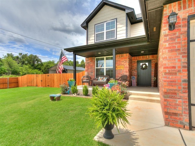 11712 Muirfield Ln, Guthrie, OK 73044 - doorway to property featuring covered porch and brick siding