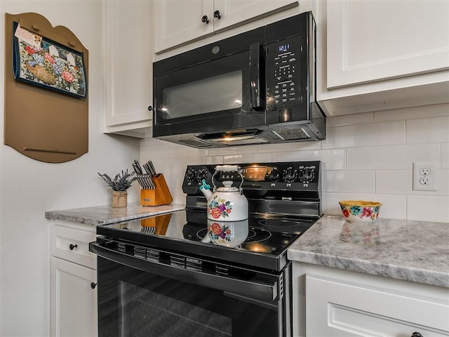 11712 Muirfield Ln, Guthrie, OK 73044 - kitchen with black appliances, backsplash, and white cabinetry
