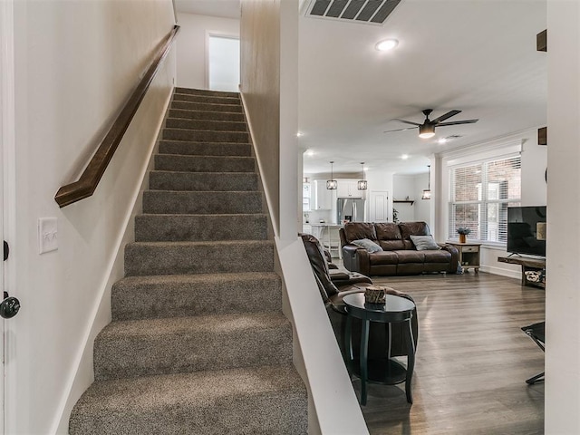 11712 Muirfield Ln, Guthrie, OK 73044 - stairway with ceiling fan, wood finished floors, and recessed lighting
