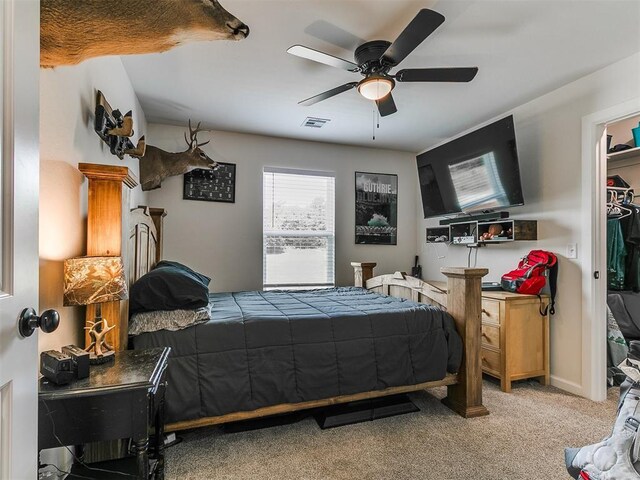 11712 Muirfield Ln, Guthrie, OK 73044 - bedroom with carpet floors and a ceiling fan