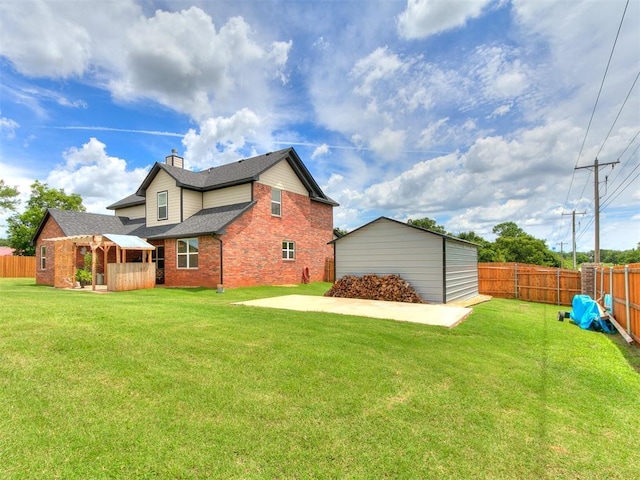11712 Muirfield Ln, Guthrie, OK 73044 - rear view of house featuring a fenced backyard, brick siding, a chimney, and roof with shingles