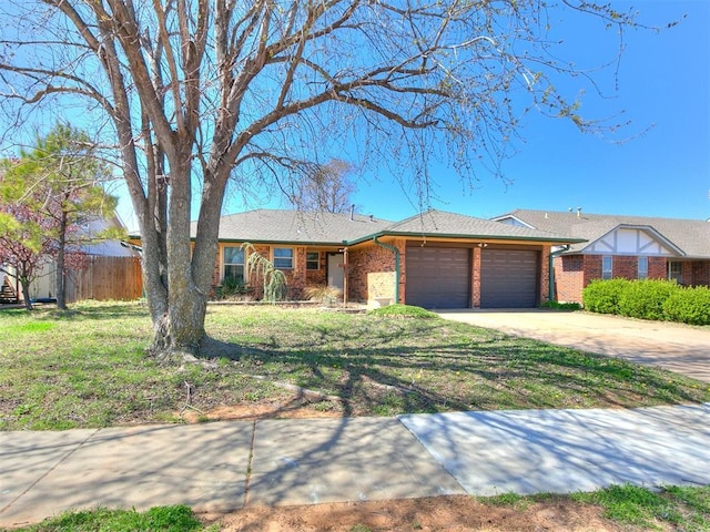 201 S Patterson Dr, Moore, OK 73160 - single story home featuring an attached garage, brick siding, and driveway