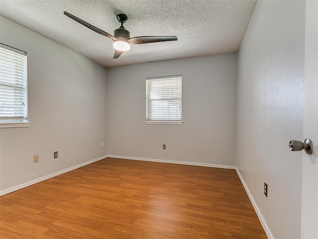 201 S Patterson Dr, Moore, OK 73160 - unfurnished room featuring ceiling fan, light wood finished floors, and a textured ceiling