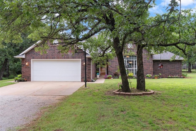 1748 Logans Run, Chandler, OK 74834 - view of front of house featuring driveway, brick siding, a front lawn, and a garage