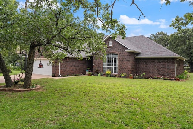 1748 Logans Run, Chandler, OK 74834 - view of front facade featuring brick siding, a front yard, driveway, and an attached garage
