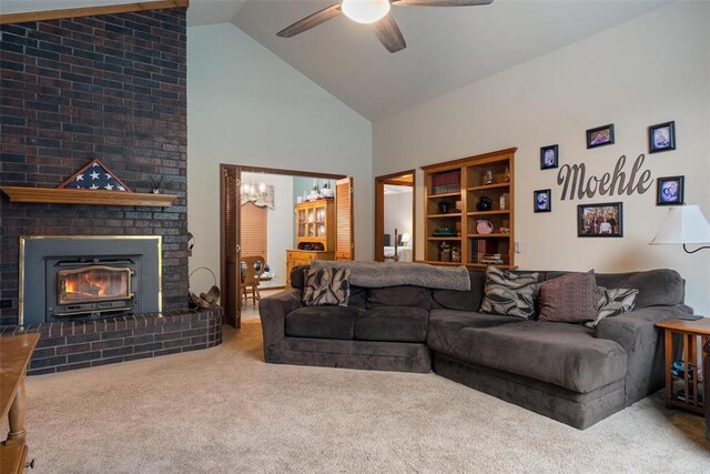 1748 Logans Run, Chandler, OK 74834 - carpeted living area with ceiling fan, high vaulted ceiling, a fireplace, and a chandelier