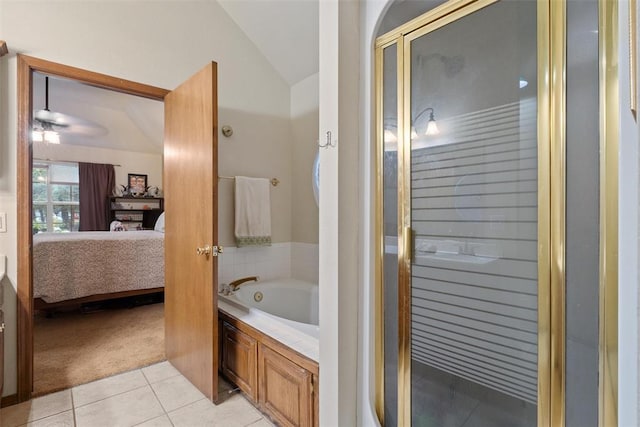 1748 Logans Run, Chandler, OK 74834 - ensuite bathroom featuring tile patterned floors, lofted ceiling, a bath, a stall shower, and a ceiling fan