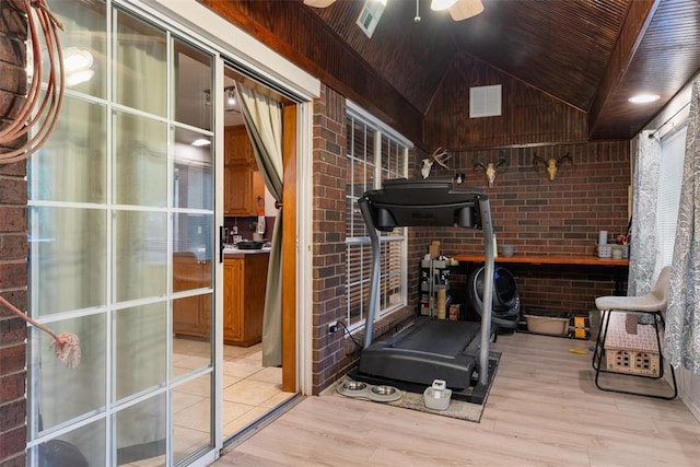 1748 Logans Run, Chandler, OK 74834 - exercise room with vaulted ceiling, light wood finished floors, brick wall, a ceiling fan, and wooden ceiling