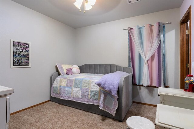 1748 Logans Run, Chandler, OK 74834 - carpeted bedroom featuring baseboards and ceiling fan