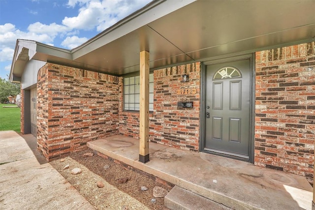 1712 N 4th St, Sayre, OK 73662 - entrance to property with a porch and brick siding