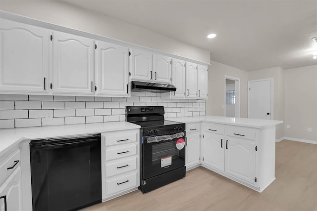 1712 N 4th St, Sayre, OK 73662 - kitchen with black appliances, under cabinet range hood, a peninsula, light wood-style floors, and decorative backsplash