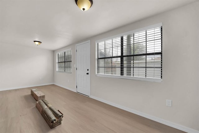 1712 N 4th St, Sayre, OK 73662 - foyer with baseboards and wood finished floors