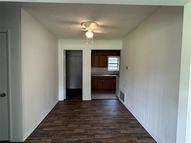 1708 W Modelle Ave, Clinton, OK 73601 - kitchen with dark wood finished floors, a ceiling fan, and light countertops