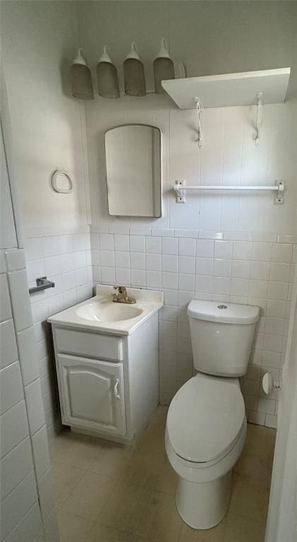 1708 W Modelle Ave, Clinton, OK 73601 - bathroom with tile walls, vanity, and tile patterned floors