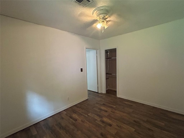 1708 W Modelle Ave, Clinton, OK 73601 - spare room featuring dark wood-style floors and ceiling fan