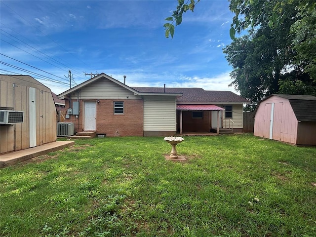 1708 W Modelle Ave, Clinton, OK 73601 - rear view of house with a storage shed, brick siding, a yard, and entry steps