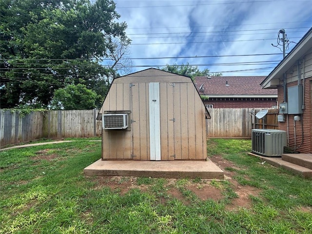 1708 W Modelle Ave, Clinton, OK 73601 - view of shed with a fenced backyard and a wall unit AC