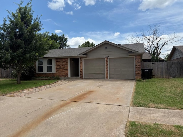 1213 Dreessen Dr, Moore, OK 73160 - ranch-style house featuring an attached garage, brick siding, driveway, and roof with shingles
