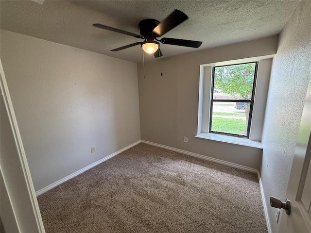 1213 Dreessen Dr, Moore, OK 73160 - spare room with carpet floors, a textured ceiling, and ceiling fan