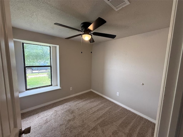1213 Dreessen Dr, Moore, OK 73160 - unfurnished room with carpet, a ceiling fan, and a textured ceiling